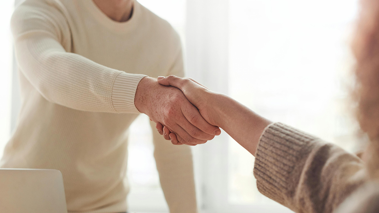 An image of two people shaking hands.