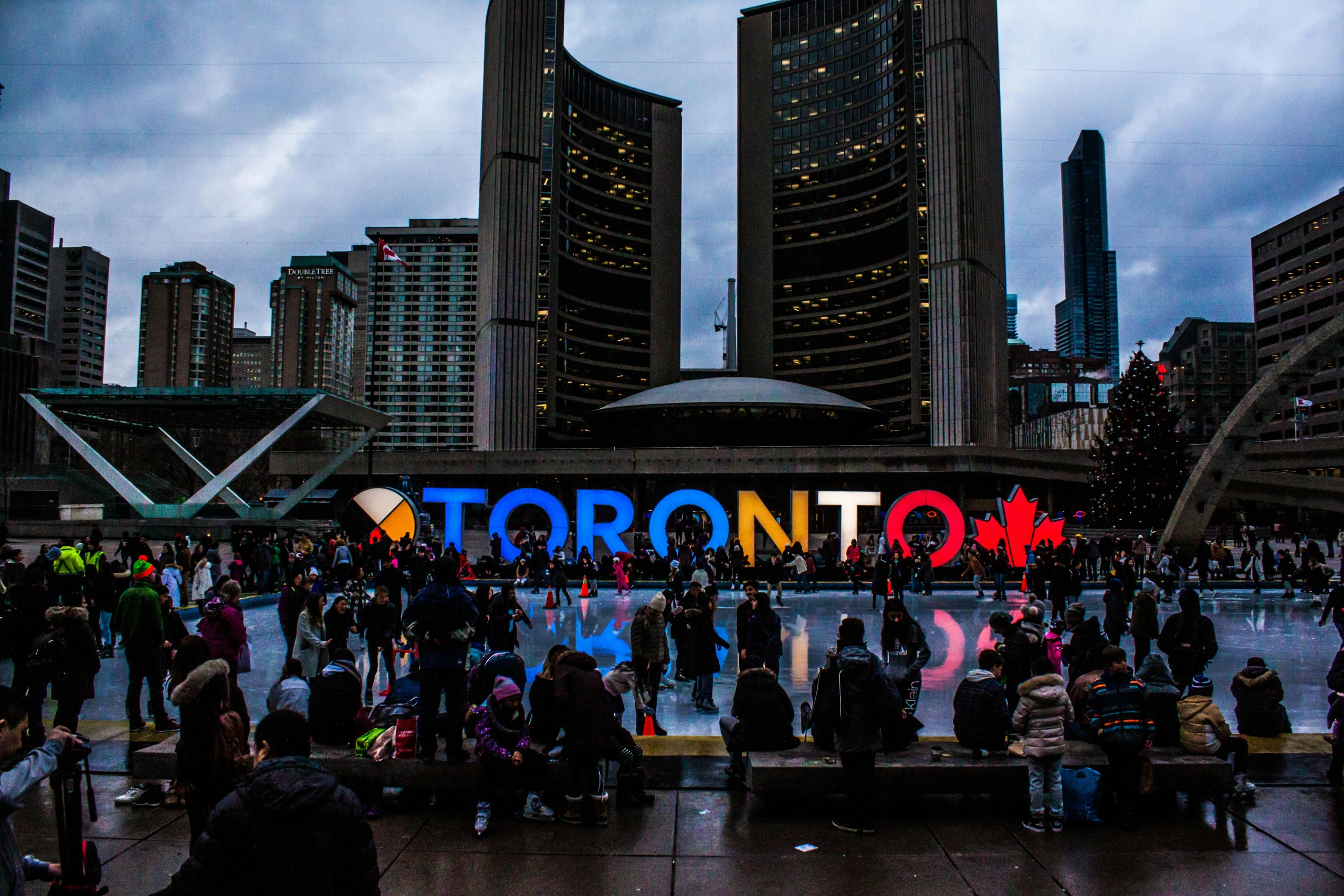 An image of the Toronto sign in front of City Hall.
