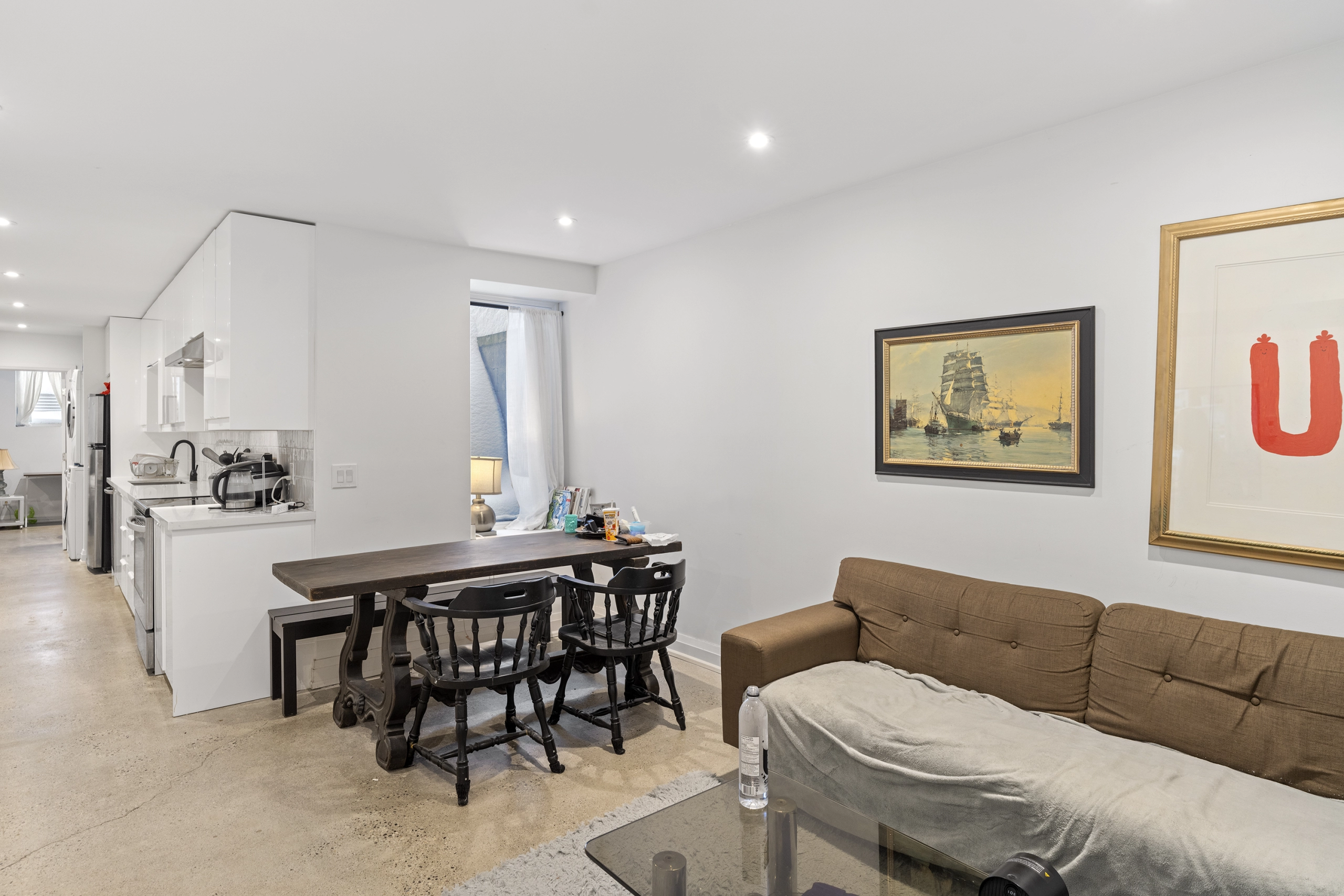 A prime example of basement apartments in Toronto featuring a fully-upgraded, legal basement apartment with large windows, full living room, and full kitchen. Located in the neighbourhood of Parkdale in Toronto.