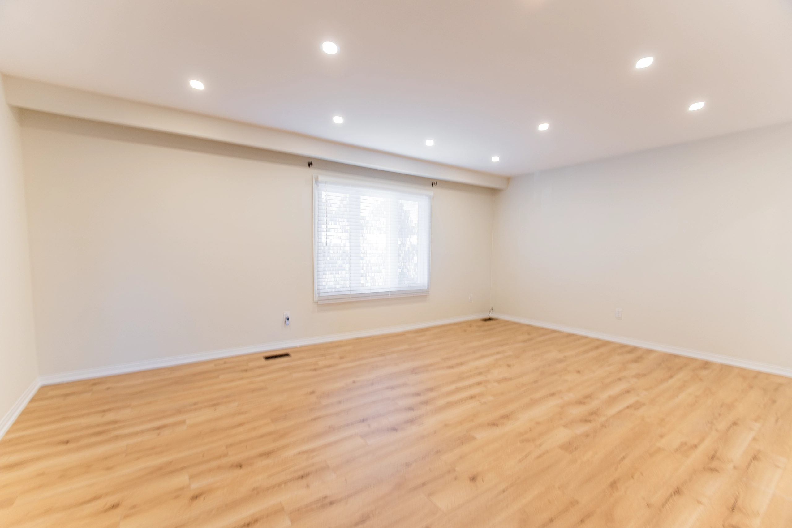 Why Toronto Rentals Sit Empty - An image of an apartment in Toronto's North York neighbourhood sitting empty. The image is of a living room empty with no furniture.