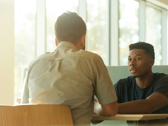 An image of a meeting between a Toronto landlord and tenant.