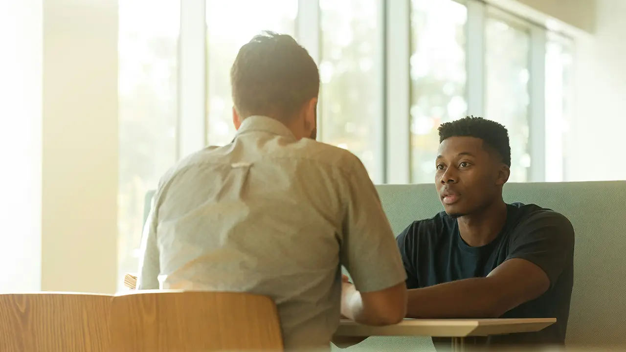 An image of a meeting between a Toronto landlord and tenant.