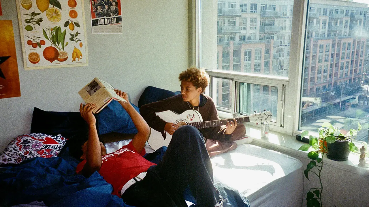 An image of two Toronto room mates in their Toronto condo.